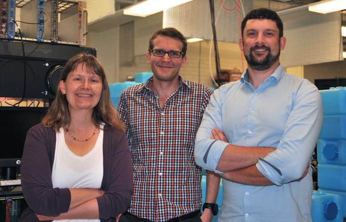 From left, Professor Kate Scholberg of Duke University is spokesperson for COHERENT, an experiment that detected interactions of high-intensity neutrinos produced by the SNS at ORNL. The experiment has been the first to observe a process predicted by theo