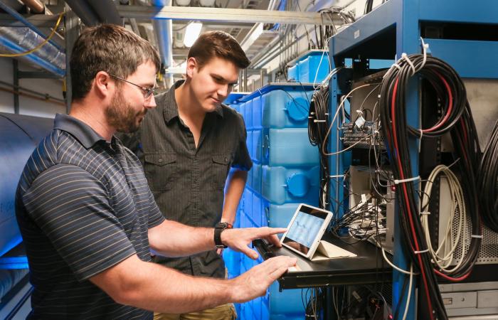 Connor Awe and Justin Raybern, both of Duke University, explore data from COHERENT, a collaboration of 80 researchers from 19 institutions and 4 nations to detect neutrinos at the SNS. Its first detection of neutrinos at the SNS used a custom cesium iodid