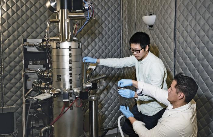 Xiahan Sang (left) and Raymond Unocic of Oak Ridge National Laboratory used scanning transmission electron microscopy and electron energy loss spectroscopy to reveal atomic positions and local electronic properties of 2D MXene.