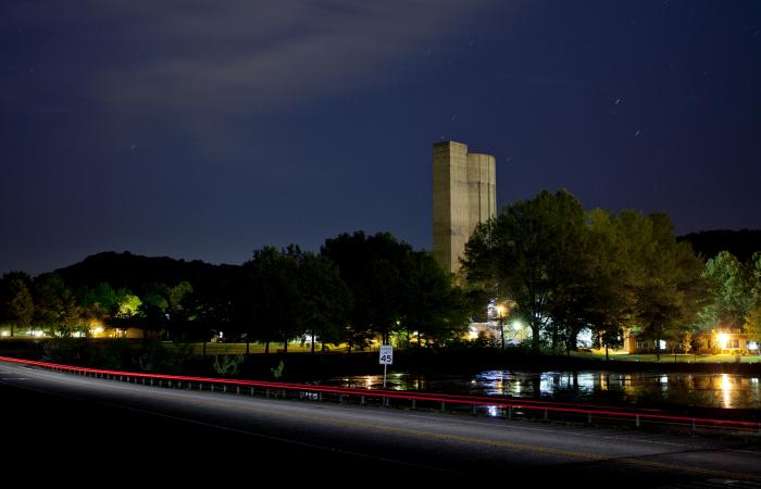 The silo-shaped tower for the 25-megavolt Tandem Electrostatic Accelerator also serves as an ORNL landmark.