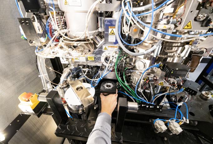 Hand reaching into equipment