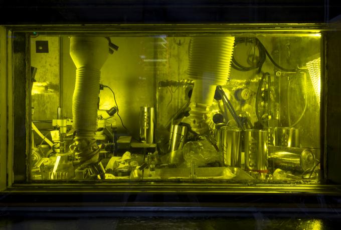 TCR - key researcher is Annabelle Le Coq, August 14, 2020. Capsule disassembly in Cell 6 at the Irradiated Materials Examination and Testing (IMET) hot cell facility, Building 3025E. Small specimens that have been irradiated are being recovered from the capsule. Operator Rick Bowman uses the mechanical arms at the hot cell window.