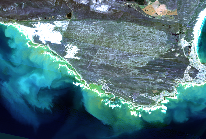 Image is an arial view of the South Africa Cape surrounded by ocean 