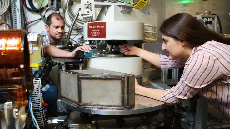 From left, ORNL’s Matthew Frost and Leah Broussard used a neutron scattering instrument at the Spallation Neutron Source to search for a dark matter twin to the neutron. Credit: Genevieve Martin/ORNL, U.S. Dept. of Energy