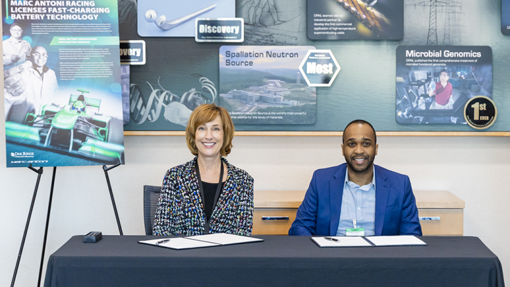 Susan Hubbard, ORNL’s deputy for science and technology, and Ricardo Marc-Antoni Duncanson, founder of Marc-Antoni Racing, celebrated the company's licensing of ORNL-developed technologies during an event on Oct. 17. Credit: Carlos Jones/ORNL, U.S. Dept. of Energy