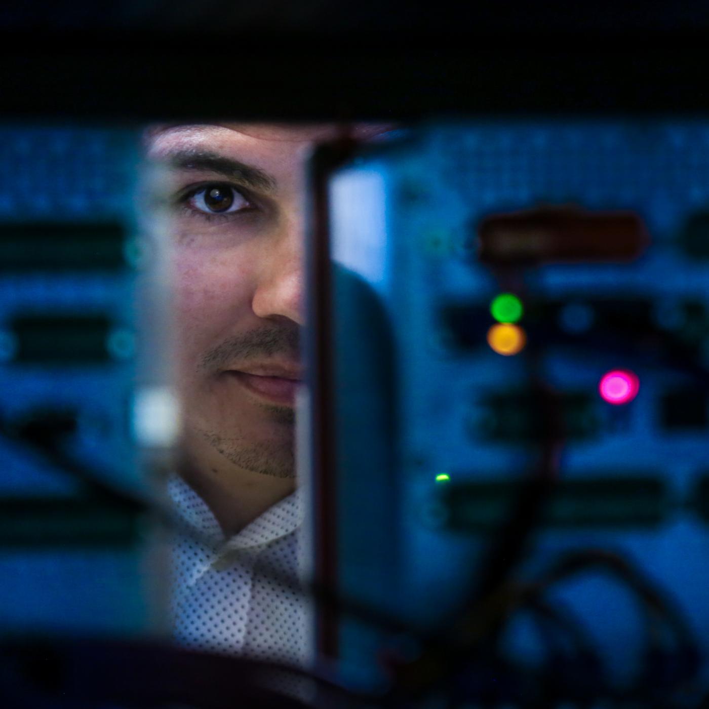 A team led by Raymond Borges Hink has developed a method using blockchain to protect communications between electronic devices in the electric grid, preventing cyberattacks and cascading blackouts. Credit: Genevieve Martin/ORNL, U.S. Dept. of Energy