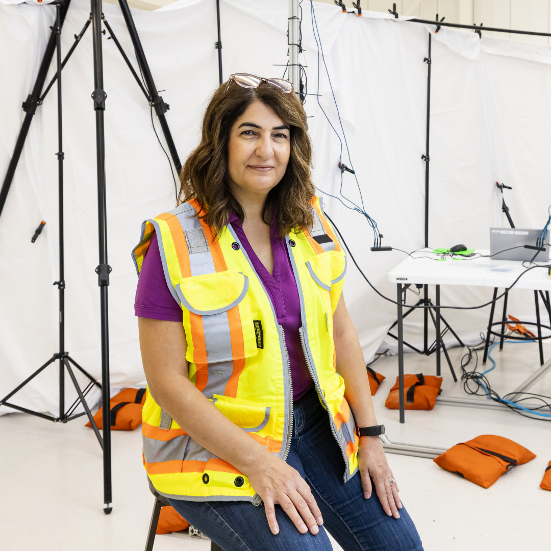 woman sitting in front of camera and sensing equipment