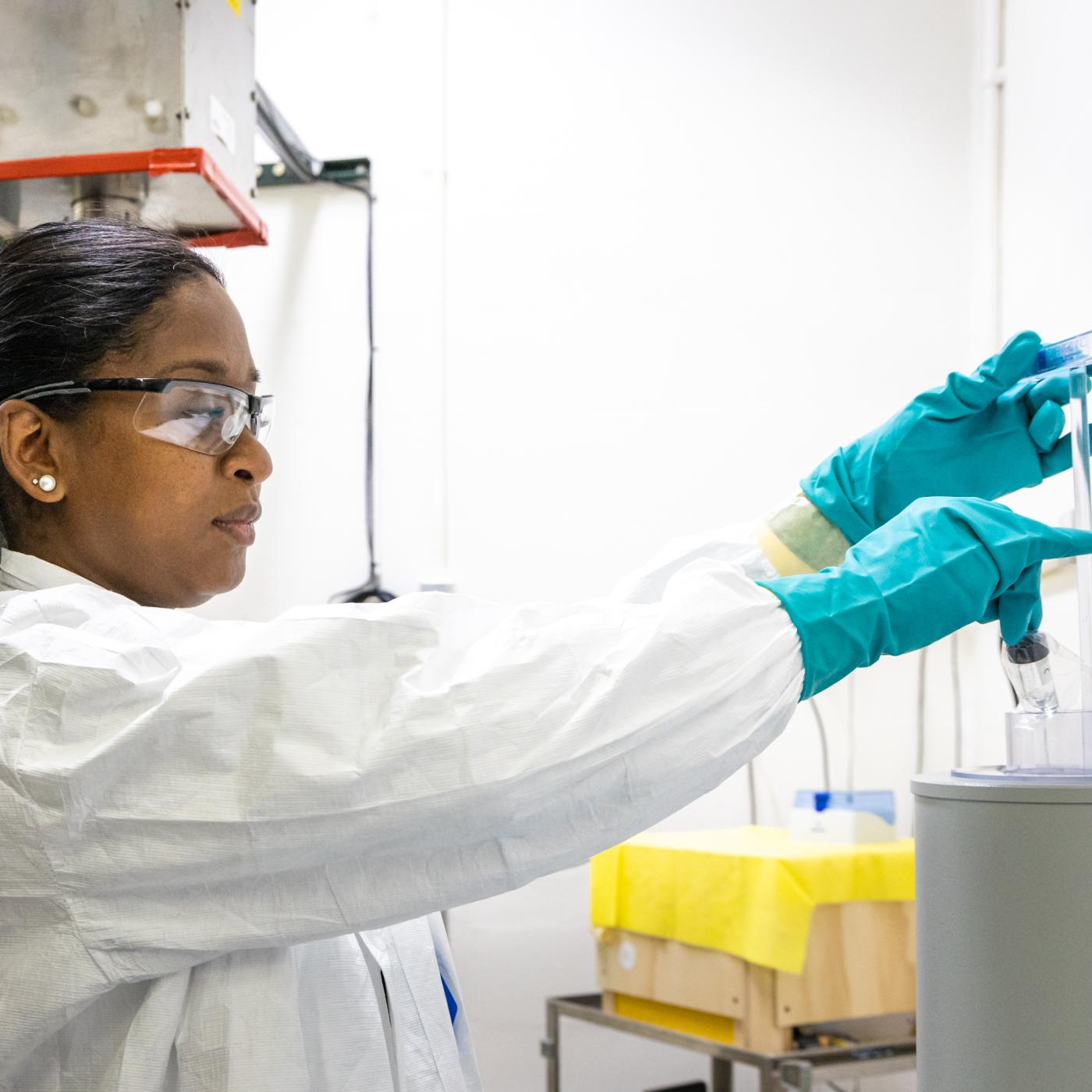 A researcher works in a lab in the Radiochemical Engineering and Development Center, or REDC,  at ORNL’s main campus. The REDC provides world-class capabilities in isotope production, research and development, source fabrication, and the distribution of various unique isotopes. Here, experts handle some of the most exotic materials in the world. Credit: Carlos Jones, ORNL/U.S. Dept. of Energy