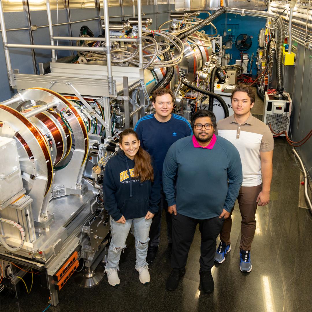 From left are UWindsor students Isabelle Dib, Dominik Dziura, Stuart Castillo and Maksymilian Dziura at ORNL’s Neutron Spin Echo spectrometer. Their work advances studies on a natural cancer treatment. Credit: Genevieve Martin/ORNL, U.S. Dept. of Energy