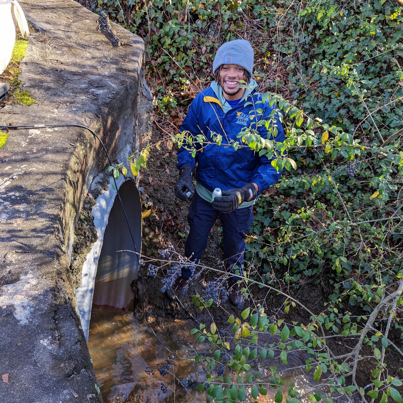 Georgia State University master’s program student Dre Presswood samples a creek in Decatur, Georgia. He will join ORNL for a summer internship to study urban watersheds as part of an RDPP project. Credit: Georgia State University
