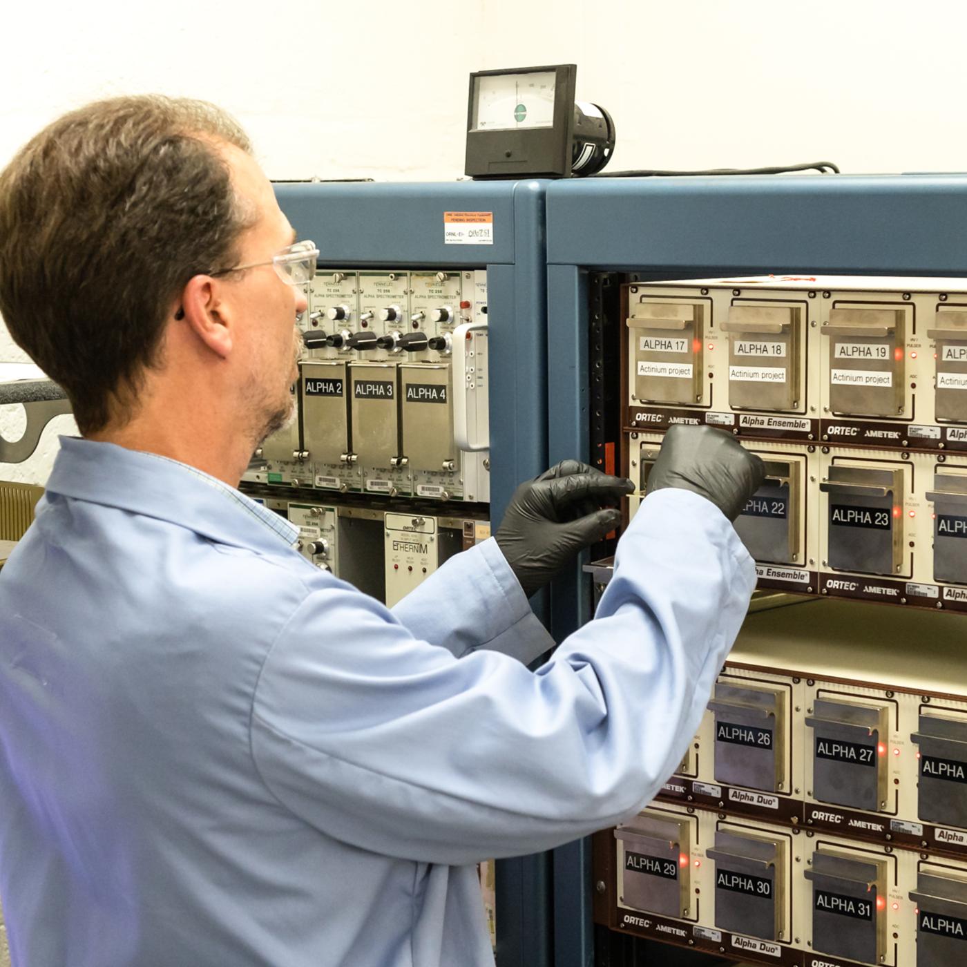 Marc Chattin of Oak Ridge National Laboratory uses an alpha spectrometer to analyze samples of isotopic plutonium with an ISO 17025-accredited method. Credit: Carlos Jones/ORNL, U.S. Dept. of Energy