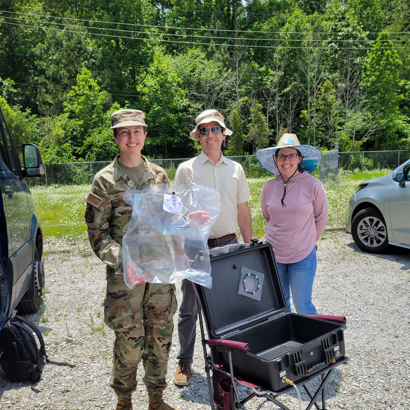 Cadet Elyse Wages, Mike Shaffer and Amanda Sandifer pose with a collected sample of air. Credit: Liz Neunsinger/ORNL, U.S. Dept. of Energy