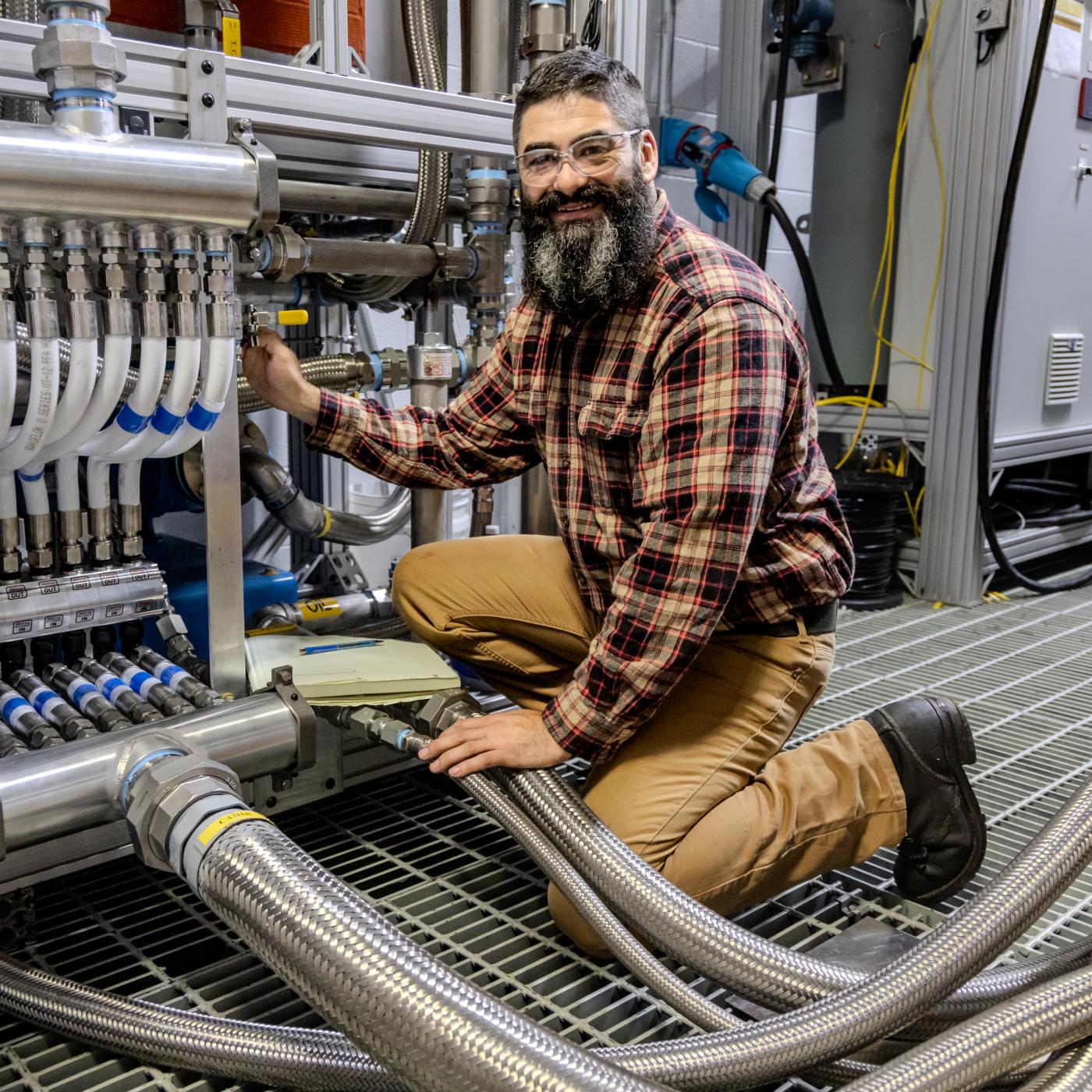 Eric Nafziger, a technical staff member at the National Transportation Research Center at Oak Ridge National Laboratory’s Hardin Valley Campus, supports the installation of the largest alternative fuels research engines for marine and rail in the U.S. Credit: Genevieve Martin/ORNL, U.S. Dept. of Energy