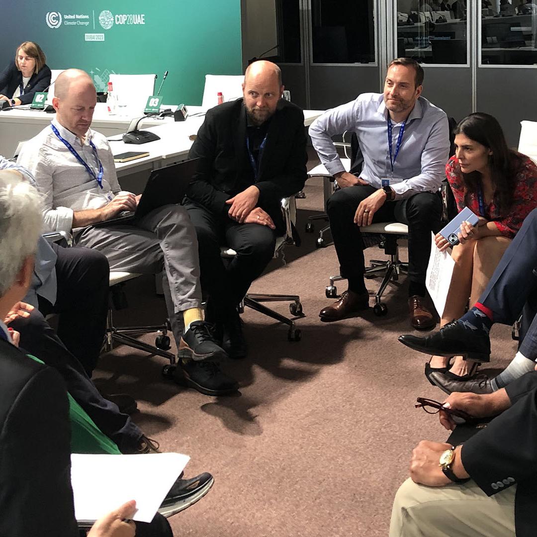 ORNL Distinguished Scientist Edgar Lara-Curzio (second from right) contributed to a working group discussion at COP28 about ways to stimulate demand for hydrogen-based fuels in maritime transportation.