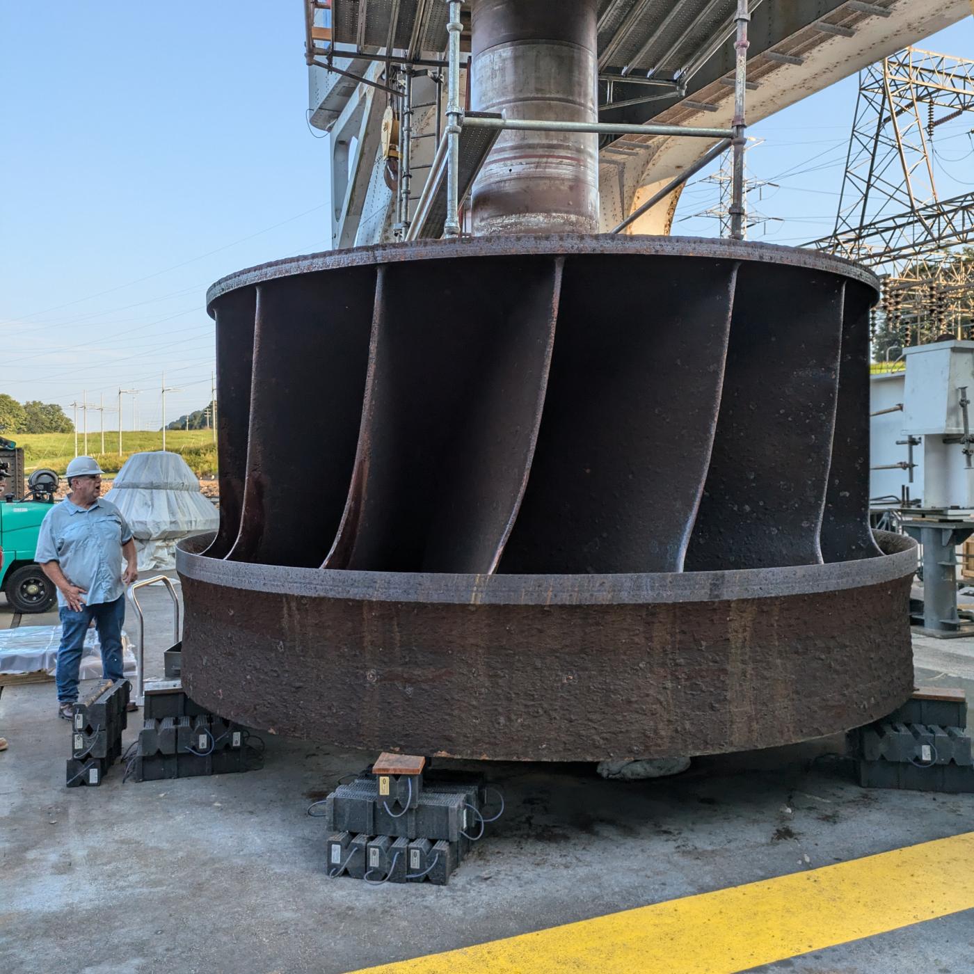 Jay Tiley inspects a hydroelectric runner from TVA’s Cherokee Dam