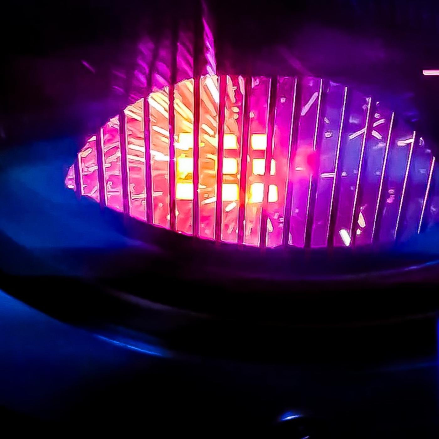 Pictured is a 3D printer that creates objects using electron beam melting, looks like a glowing orb. 