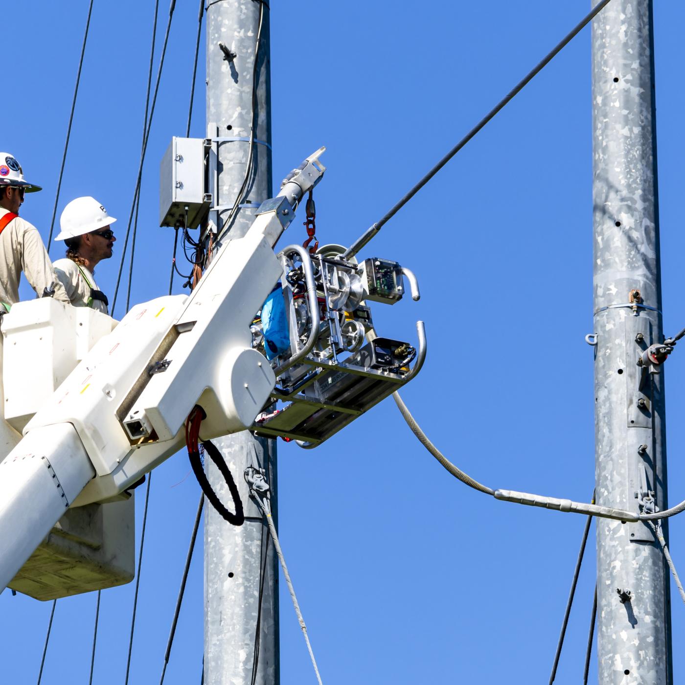 The Prysmian robot is installed on a power line before dispensing its coating 