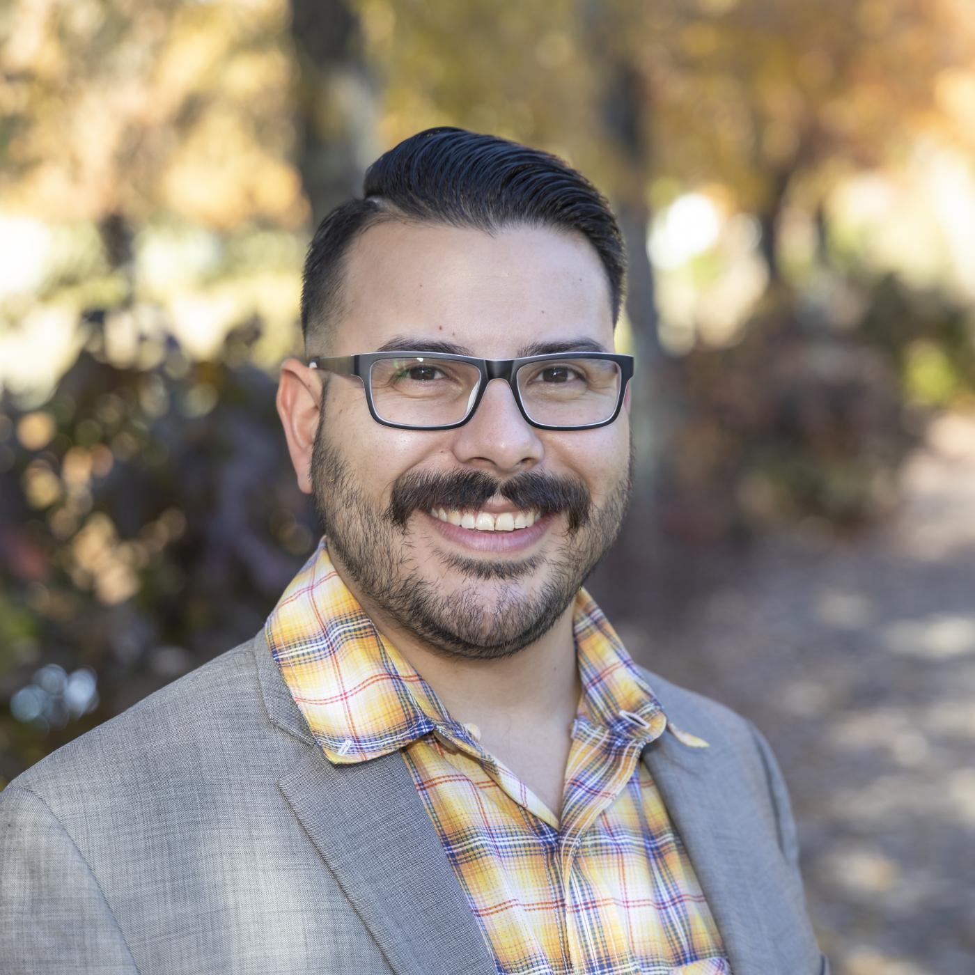 Photograph of smiling man in outdoor setting