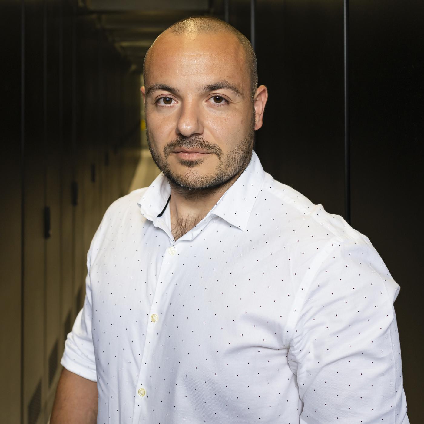 Max Pasini casual portrait in between server cabinets