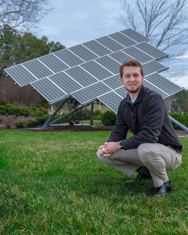 Ben Ollis in front of ORNL Solar Array