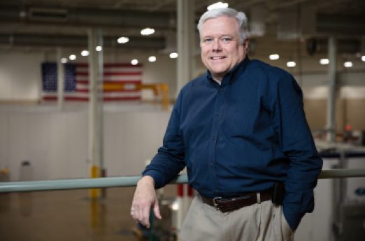 Scott Smith standing above MDF high bay