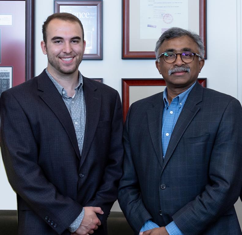 Sweetwater High School senior Will Brackett (left) is congratulated by ORNL Director Thomas Zacharia on receiving the 2019 UT-Battelle Scholarship.