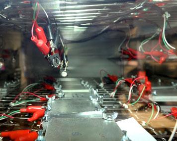 Pouch and coin cells being tested in an environmental chamber held at 30°C