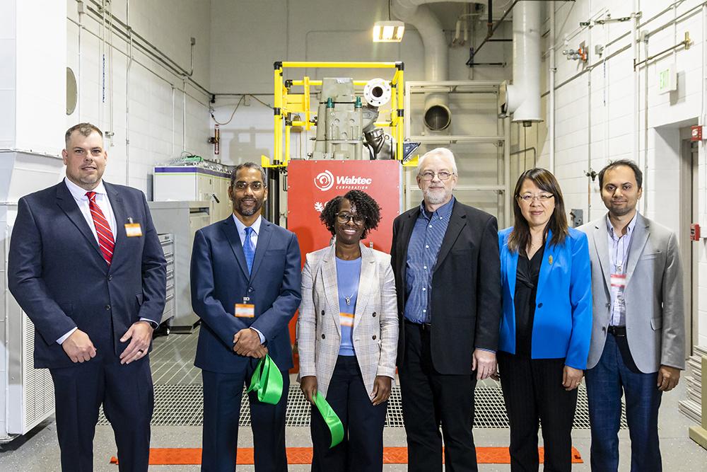 Oak Ridge and Argonne National Laboratories are teaming with Wabtec Corp. to develop a locomotive engine that can run on low-carbon fuels like hydrogen. Members of the team were joined by representatives from the Departments of Energy and Transportation to kick off the project Nov. 9 at ORNL. Pictured left to right are: Jim Gamble, Vice President, Engine and Power Solutions Technology, Wabtec; Siddiq Khan, Technology Development Manager, DOE’s Vehicle Technologies Office; Melissa Shurland, Program Manager, 