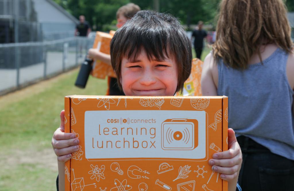 A student at Oliver Springs Middle School shows off his Learning Lunchbox. ORNL provided the hands-on STEM kits to students across TN in response to a grant request from the Center of Science and Industry (COSI).