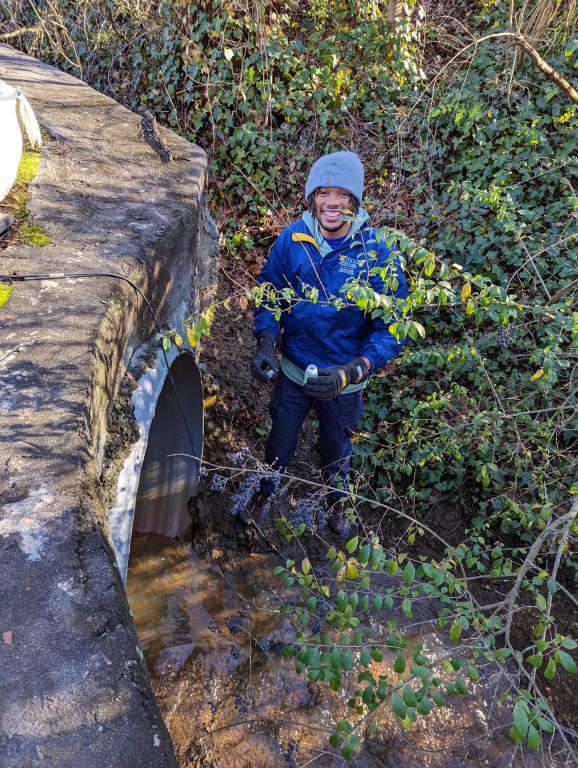 Georgia State University master’s program student Dre Presswood samples a creek in Decatur, Georgia. He will join ORNL for a summer internship to study urban watersheds as part of an RDPP project. Credit: Georgia State University