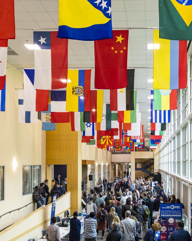 Oak Ridge National Laboratory staff and visitors gathered on “Main Street” to dedicate a renovated International Hall of flag and unveil new displays reflecting the lab’s rich 80-year history. Credit: Carlos Jones/ORNL, U.S. Dept. of Energy