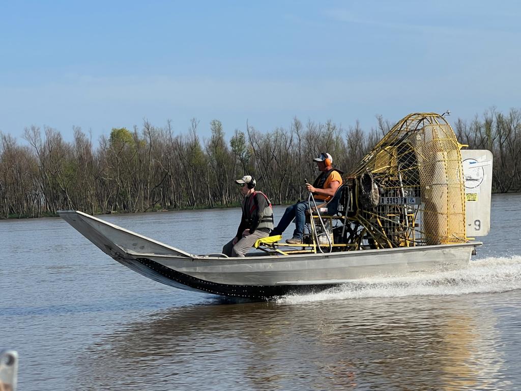 Geoff Schwaner rides in the airboat with a local driver. Credit: Matthew Berens/ORNL, U.S. Dept. of Energy
