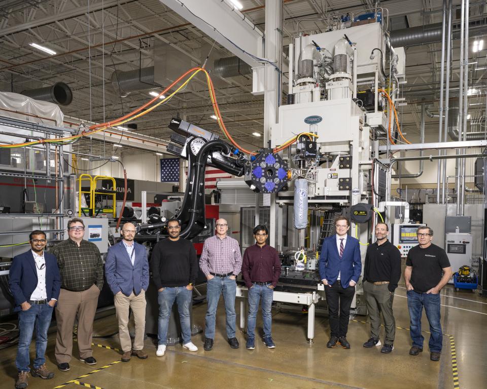 Researchers pictured here at the DOE Manufacturing Demonstration Facility at ORNL developed the R&D 100 Award-winning hybrid additive manufacturing-compression molding, or AM-CM, technology. Credit: ORNL, U.S Dept. of Energy