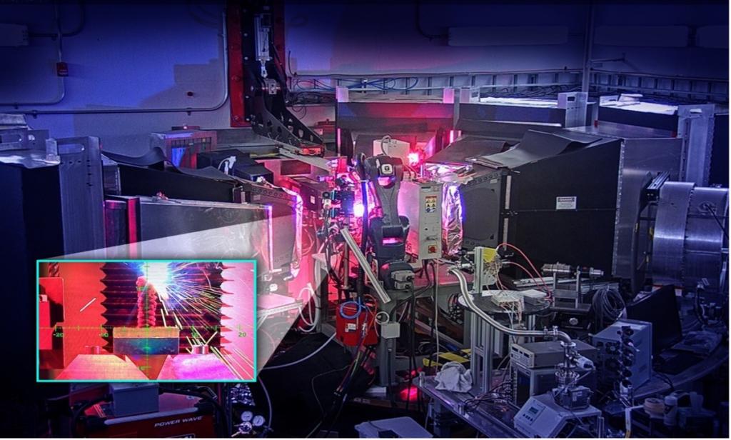 The OpeN-AM experimental platform, installed at the VULCAN instrument, features a robotic arm that prints layers of molten metal to create complex shapes. Credit: Jill Hemman ORNL, U.S Dept. of Energy