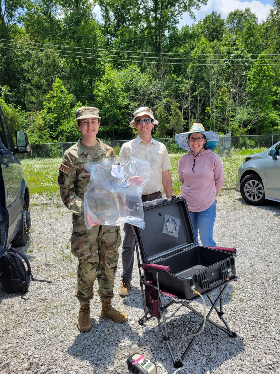Cadet Elyse Wages, Mike Shaffer and Amanda Sandifer pose with a collected sample of air. Credit: Liz Neunsinger/ORNL, U.S. Dept. of Energy