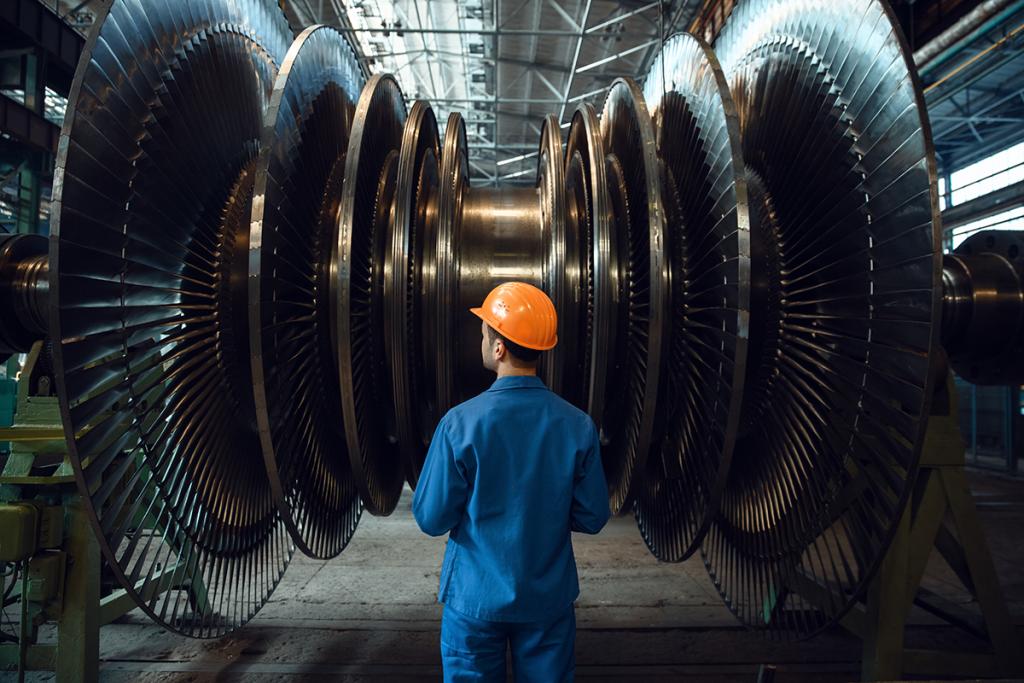 Worker inspects gas turbine