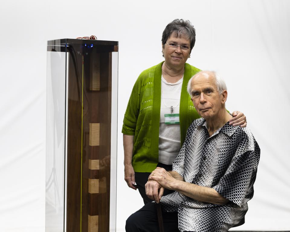 ORNL retiree Duane Starr and his wife, Nancy, pose with the critical frequencies demo unit Duane designed, built and donated to the laboratory to support nuclear workshops. Credit: Carlos Jones/ORNL, Dept. of Energy