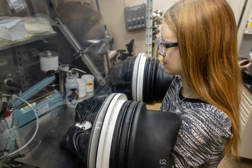 Blair used a glovebox in the experiments, which required close collaboration and careful design by Doucet so the project could make the most of limited beam time. Credit: Genevieve Martin/ORNL, U.S. Dept. of Energy