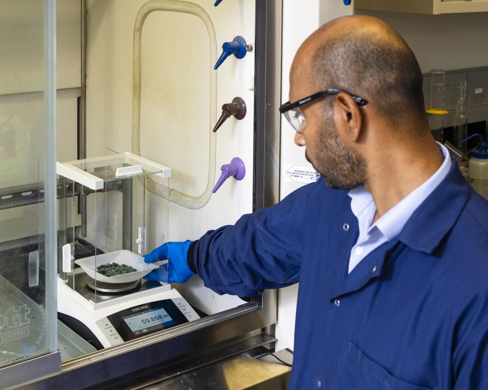 ORNL’s Syed Islam weighs nickel sulfate recovered from end-of-life lithium-ion batteries to determine the yield and efficiency of the critical material recovery process. Carlos Jones/ORNL, U.S. Dept. of Energy