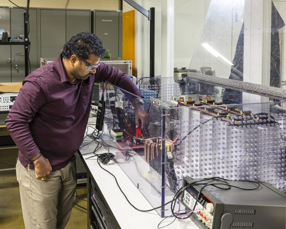 Prasad Kandula builds a medium-voltage solid state circuit breaker as part of ORNL's project to develop medium-voltage power electronics in GRID-C. Credit: Carlos Jones/ORNL, U.S. Dept. of Energy