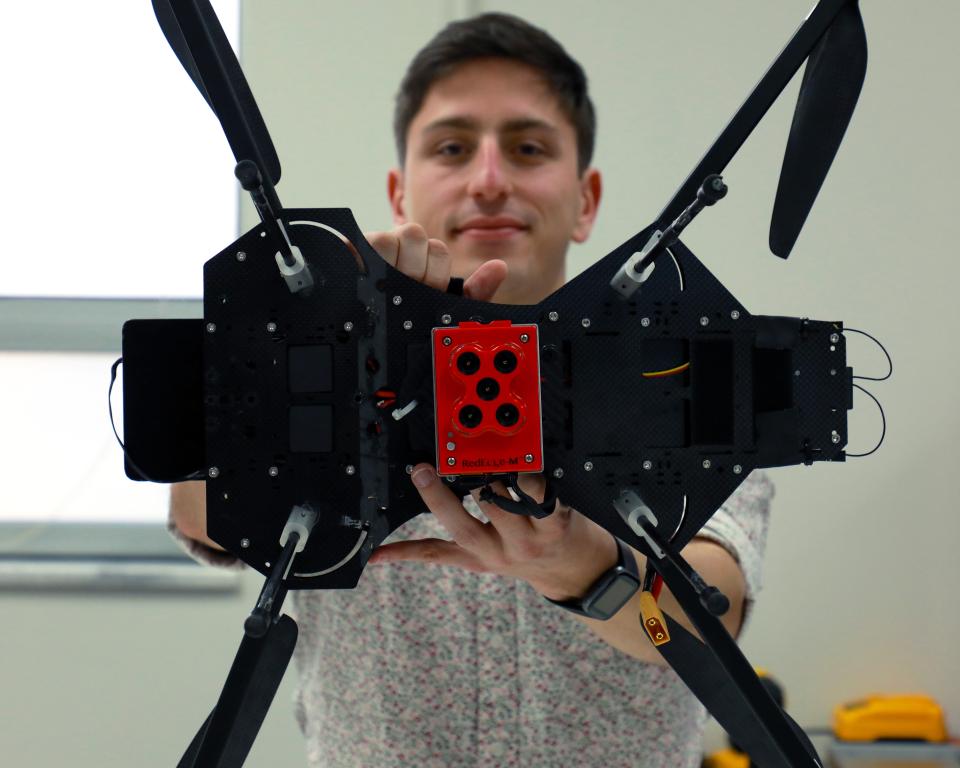 ORNL intern Jack Orebaugh holds the drone used in his research to help locate human remains. Credit: Lena Shoemaker/ORNL, U.S. Dept. of Energy