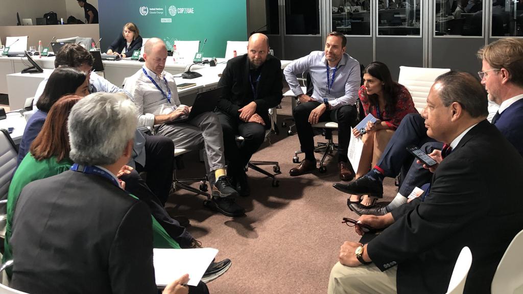 ORNL Distinguished Scientist Edgar Lara-Curzio (second from right) contributed to a working group discussion at COP28 about ways to stimulate demand for hydrogen-based fuels in maritime transportation.