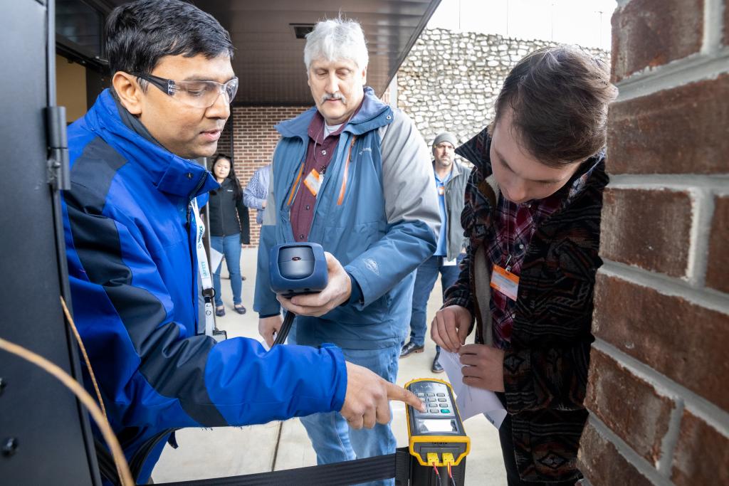 ORNL’s Sachin Nimbalkar, left, demonstrates process heating and diagnostic equipment that can quickly identify energy efficiency opportunities for manufacturing plants. These energy efficiency opportunities are essential for helping industry reduce carbon emissions. Credit: ORNL, U.S. Dept. of Energy