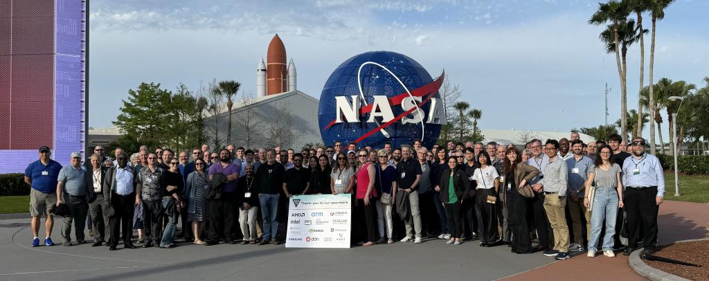 SOS26 attendees standing in front of the Kennedy Space Center on Merrit Island, Florida the night of their dinner reception provided by the conference sponsors. The keynote speaker was Rupak Biswas from NASA. Credit: Judy Potok/ORNL, U.S. Dept. of Energy