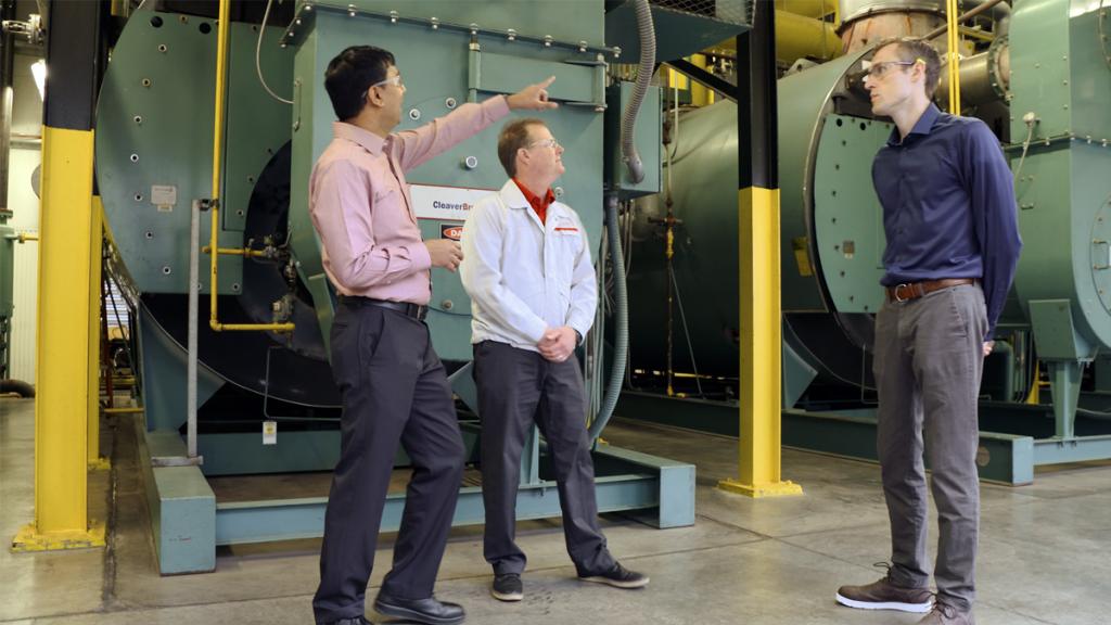 ORNL’s Sachin Nimbalkar, left, visits Better Plants Climate Challenge partner Nissan North America Inc., to talk about how switching boilers to natural gas has led to significant improvements in energy efficiency and carbon reduction for the automobile manufacturer. Credit: ORNL, U.S. Dept. of Energy