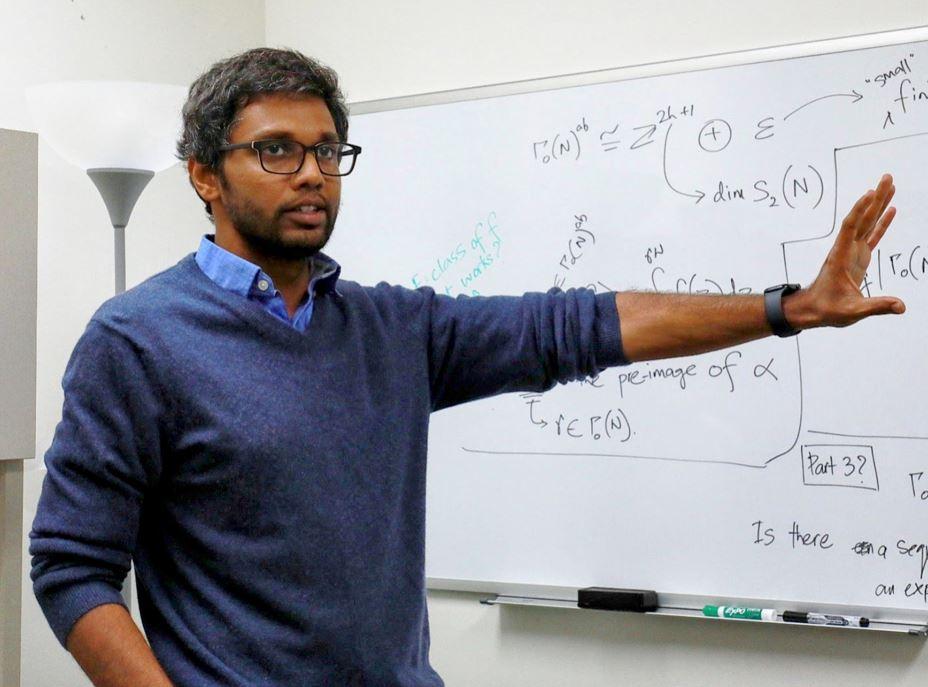 ORNL's Suhas Sreehari explains the algebraic and topological foundations of representation systems, used in generative AI technology such as large language models. Credit: Lena Shoemaker/ORNL, U.S. Dept. of Energy