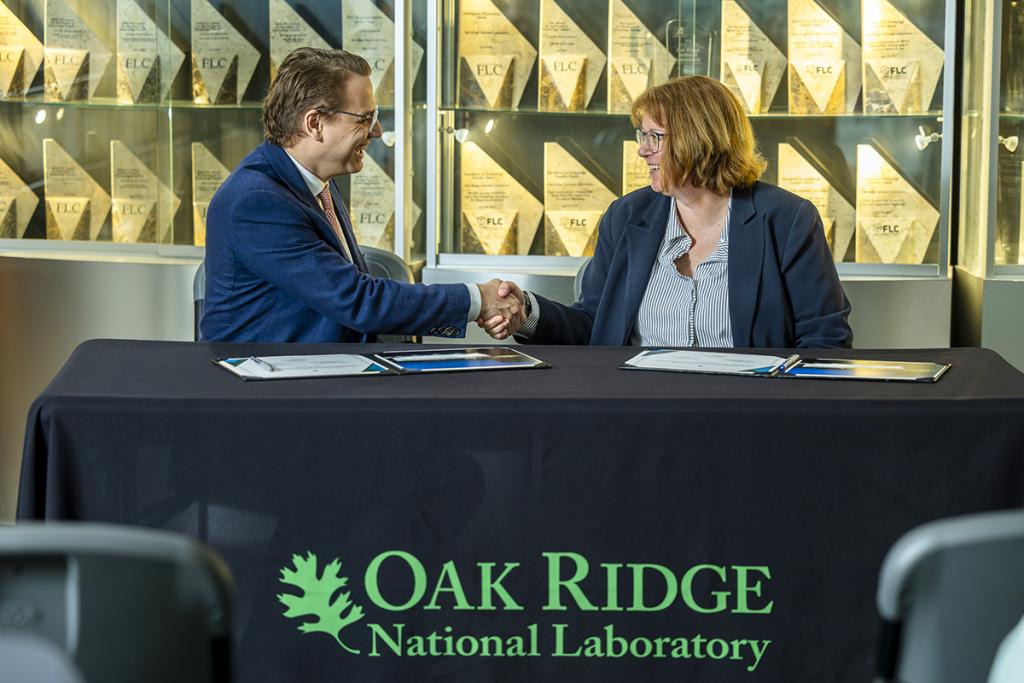 Hood Whitson, chief executive officer of Element3, and Cynthia Jenks, associate laboratory director for the Physical Sciences Directorate, shake hands during the Element3 licensing event at ORNL on May 3, 2024. Credit: Carlos Jones/ORNL, U.S. Dept. of Energy