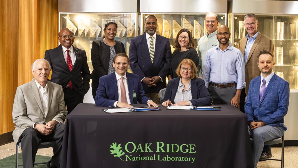 Seated, from left to right, are Bruce Moyer, ORNL corporate fellow; Hood Whitson, Element3 CEO; Cynthia Jenks, ORNL associate laboratory director for the Physical Sciences Directorate; and Wes Kowalczuk, an engineer with Element3. Standing, from left to right, are Parans Paranthaman, ORNL corporate fellow; Jayanthi Kumar, ORNL staff scientist; Reis Alsberry, ORNL commercialization manager; Jennifer Caldwell, ORNL director of technology transfer; Eugene Cochran, technology commercialization group leader; Sye