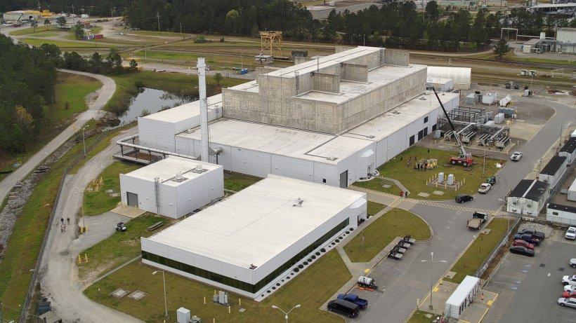 Ariel view of the Salt Waste Processing Facility, which is big, white and square.