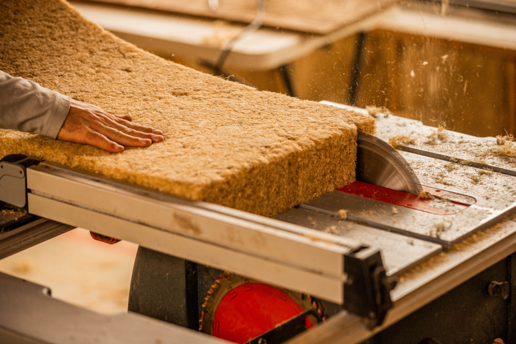 HempWool, Hempitecture’s hemp fiber batt insulation is being cut here